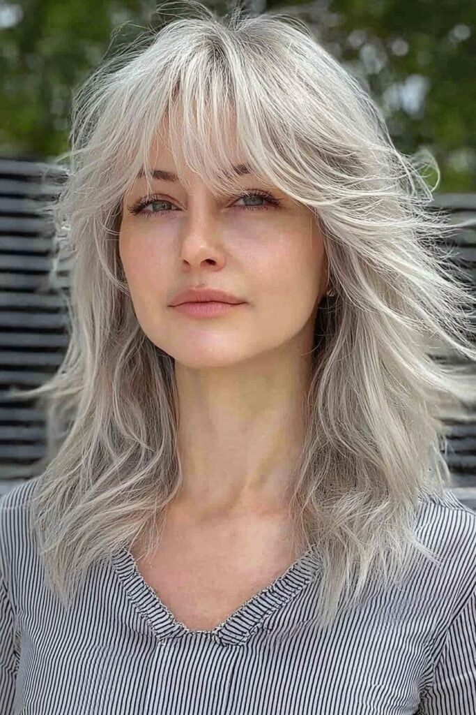 Shoulder-Length Ash Blonde Wolf Cut With Full Bangs Shoulder-Length Ash Blonde Wolf Cut With Full Bangs — Classy Wavy Haircuts