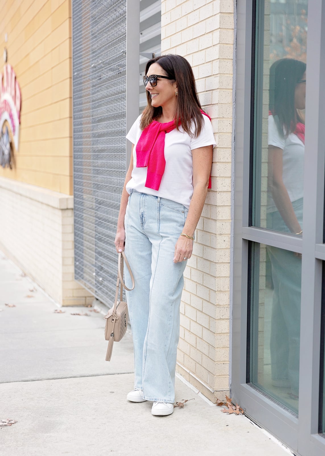 Pink Sweater Draped Over Wide Leg Jeans Pink Sweater Draped Over Wide Leg Jeans — Classy Wide Leg Jeans Outfits