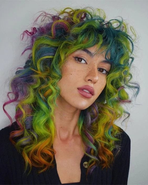 Vibrant Rainbow Collarbone Shag With Full Bangs Vibrant Rainbow Collarbone Shag With Full Bangs — Curly Hair Dye Styles