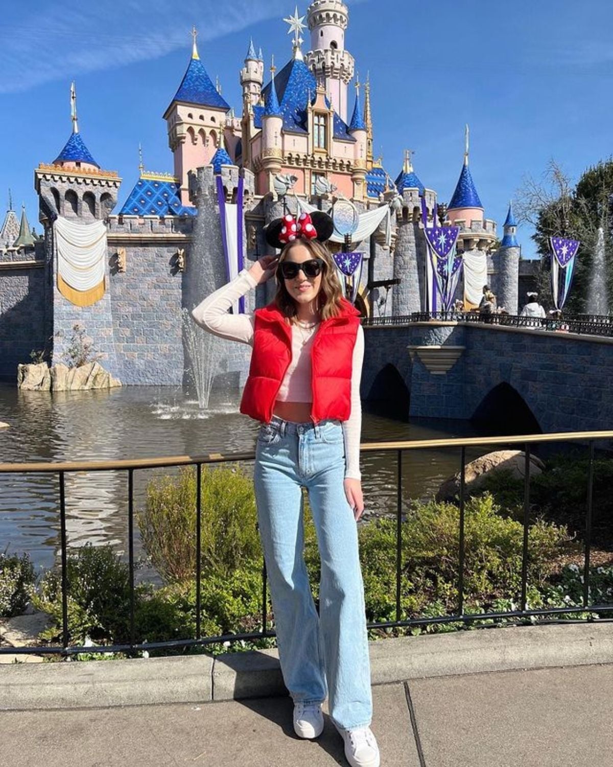 Red Puffer Vest Over Long-Sleeve Shirt and Wide-Leg Jeans Red Puffer Vest Over Long-Sleeve Shirt and Wide-Leg Jeans — Cute Disney Outfit Inspo
