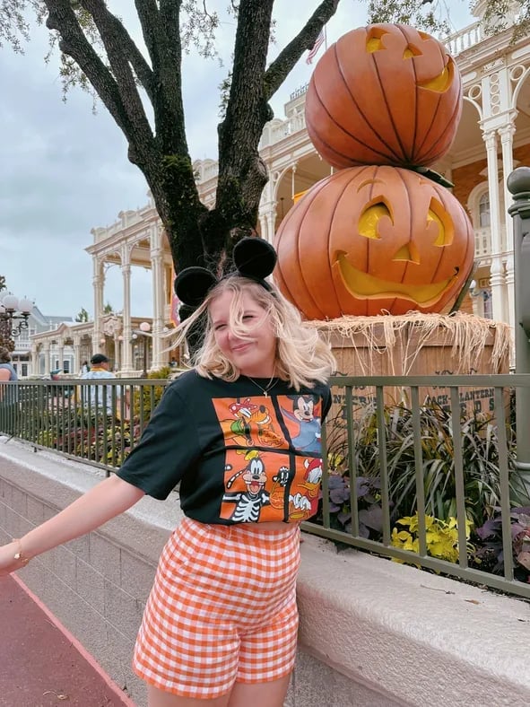 Black Graphic Tee with Orange Gingham Shorts, Office-Safe Version Black Graphic Tee with Orange Gingham Shorts, Office-Safe Version — Cute Disney Outfit Inspo