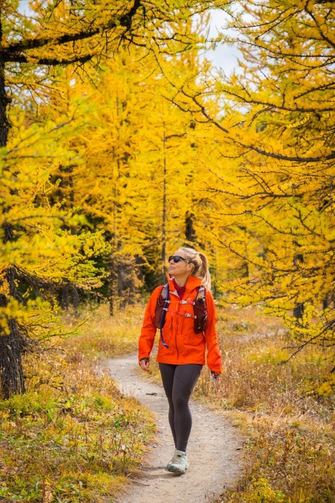 Bright Orange Jacket Over Red T-Shirt And Gray Leggings Bright Orange Jacket Over Red T-Shirt And Gray Leggings — Cute Hiking Outfit Inspo