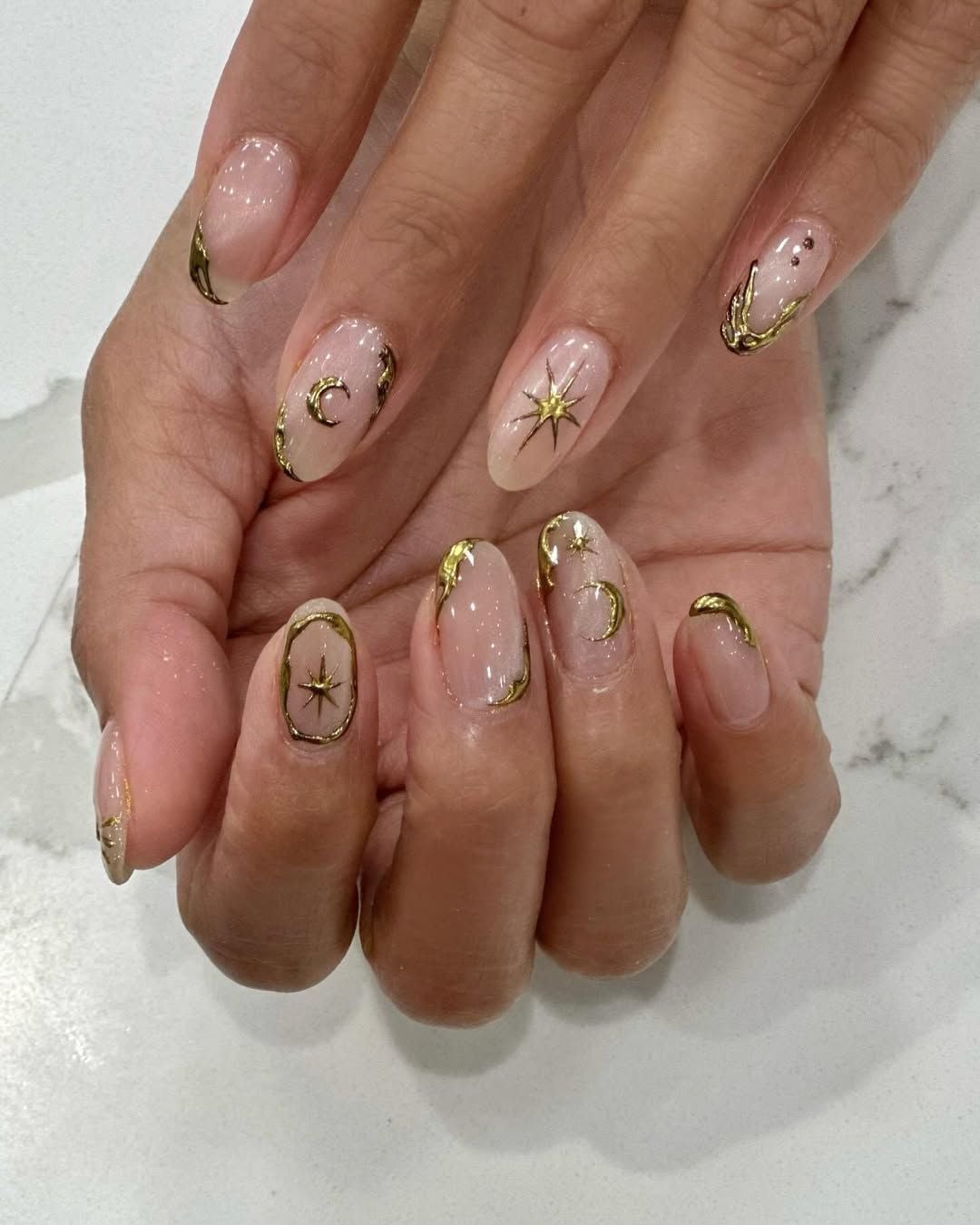 Sheer Nude Medium Almond With Gold Celestial Motifs — Cute Medium Nails