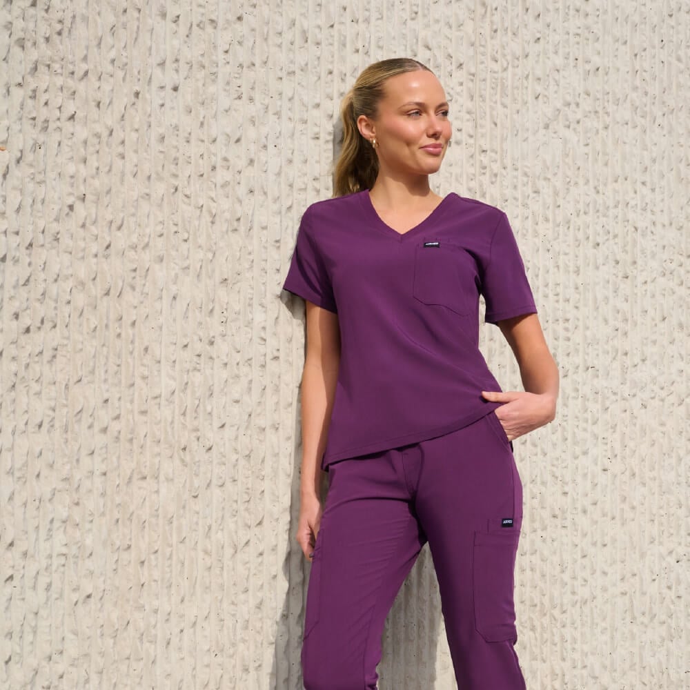 Deep Purple Jogger Scrub Set with Hoop Earrings Deep Purple Jogger Scrub Set with Hoop Earrings — Cute Scrubs Outfits