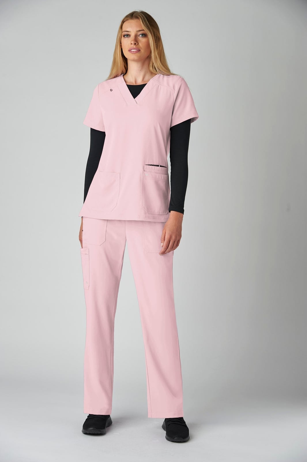 Light Pink Scrub Set Over Black Long-Sleeve Shirt Light Pink Scrub Set Over Black Long-Sleeve Shirt — Cute Scrubs Outfits