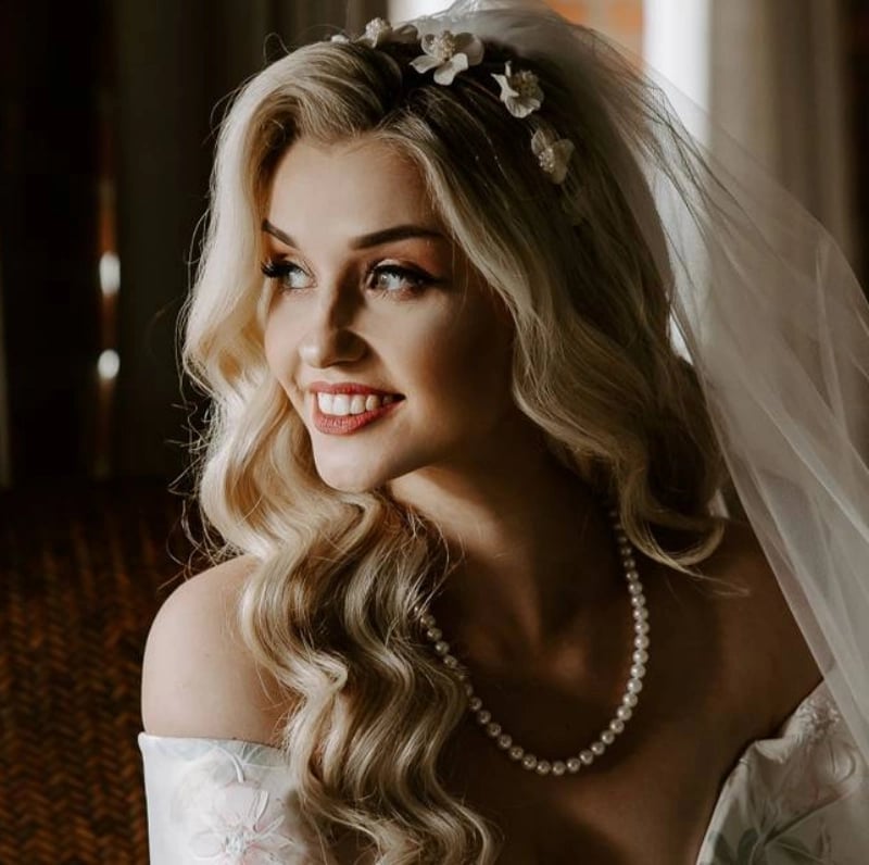 Platinum Blonde Lob With Curtain Bangs and Floral Headband — Easy Wedding Hairstyles for Long Hair