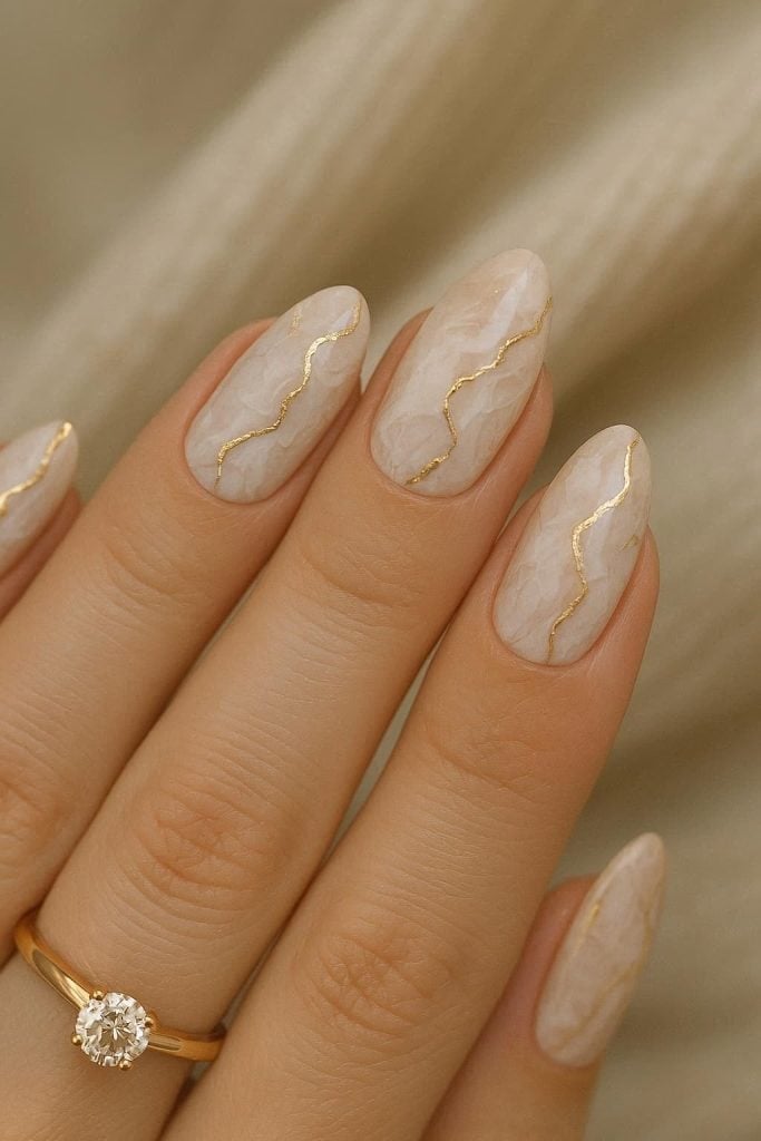 Creamy Beige Marble Gold Line Glossy Almond Nails — Elegant Bridal Nails
