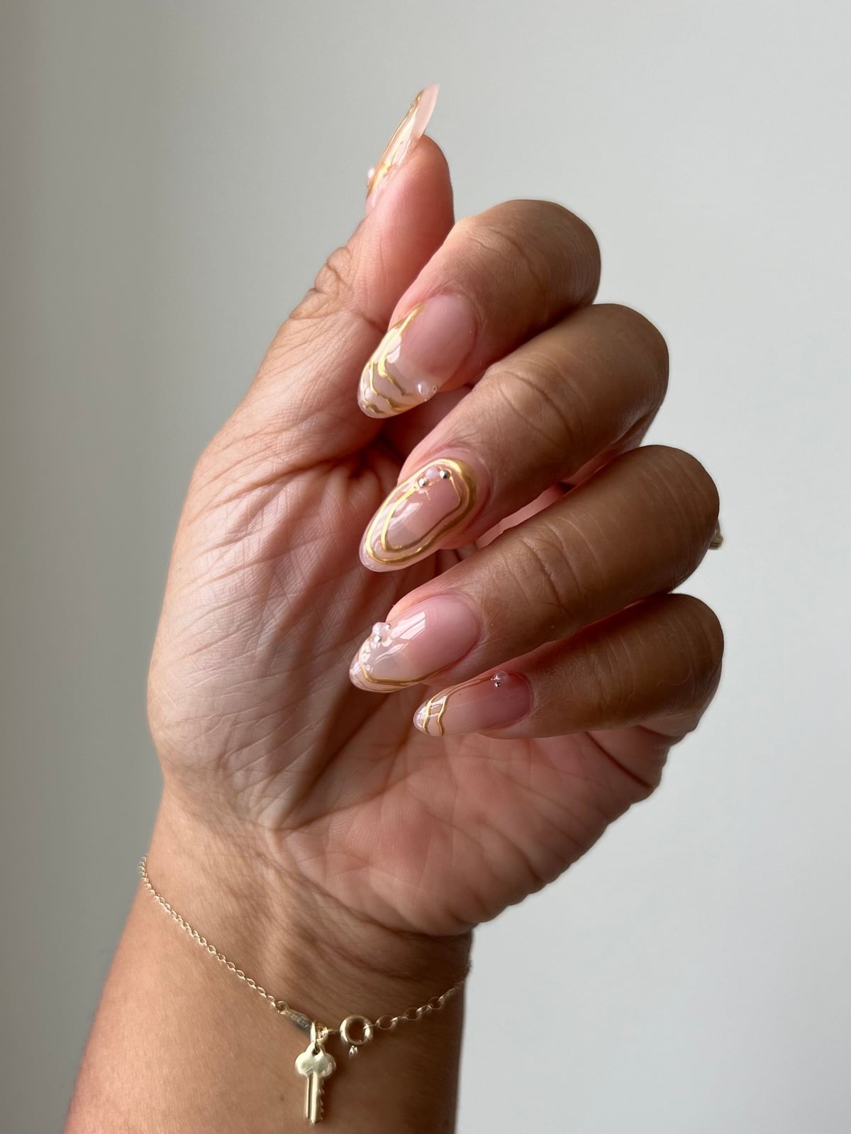Long Almond Gold Swirl Abstract Glossy Nails — Elegant Bridal Nails