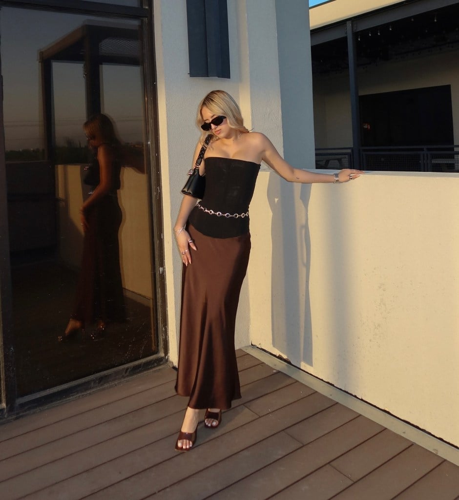 Brown Satin Maxi Skirt with Black Strapless Top and Chain Belt — Elegant Brown Satin Skirt Outfit