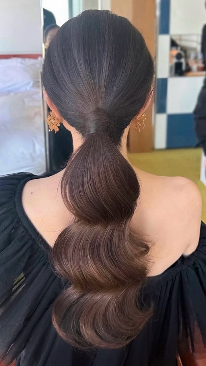 Dark Brown Low Ponytail With Voluminous Waves — Elegant Low Ponytail Hairstyles