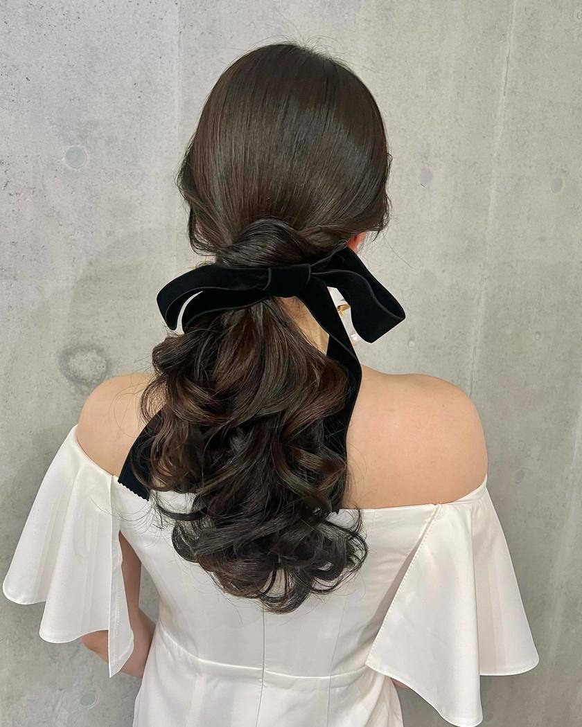 Dark Brown Wavy Low Ponytail With Velvet Bow — Elegant Low Ponytail Hairstyles