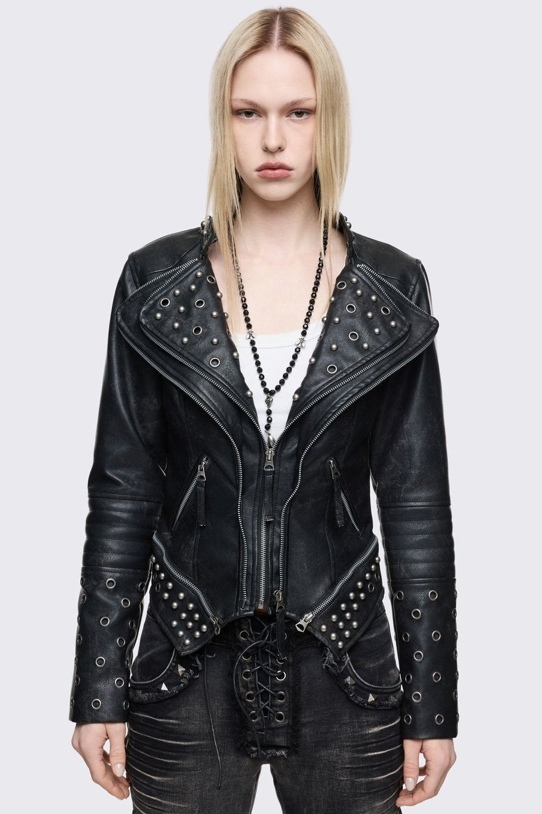 Heavily Studded Leather Moto Jacket Over a White Tank Top Heavily Studded Leather Moto Jacket Over a White Tank Top — Elegant Rock Outfits