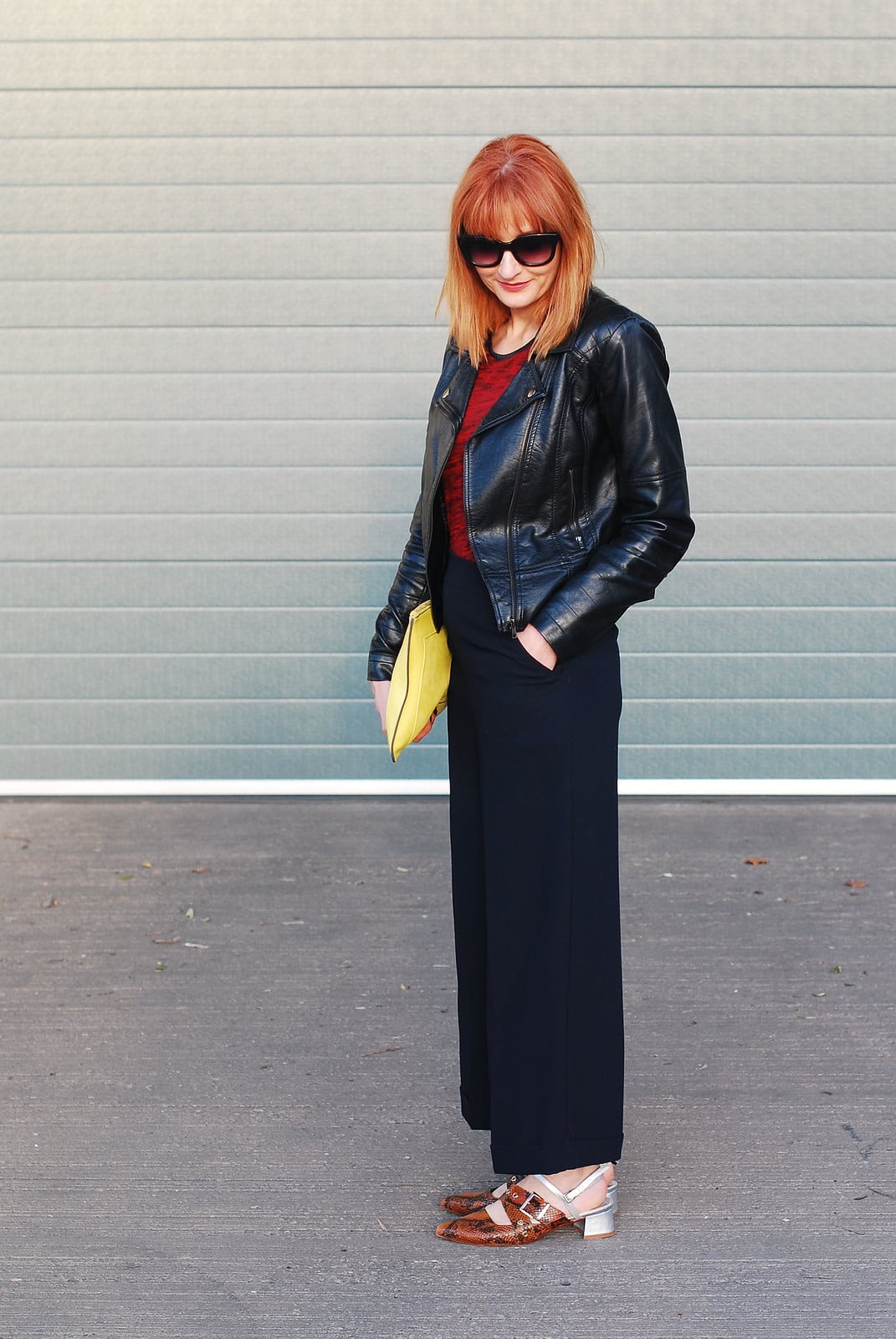 Black Leather Jacket Over a Red Top with Navy Wide-Leg Trousers Black Leather Jacket Over a Red Top with Navy Wide-Leg Trousers — Elegant Rock Outfits