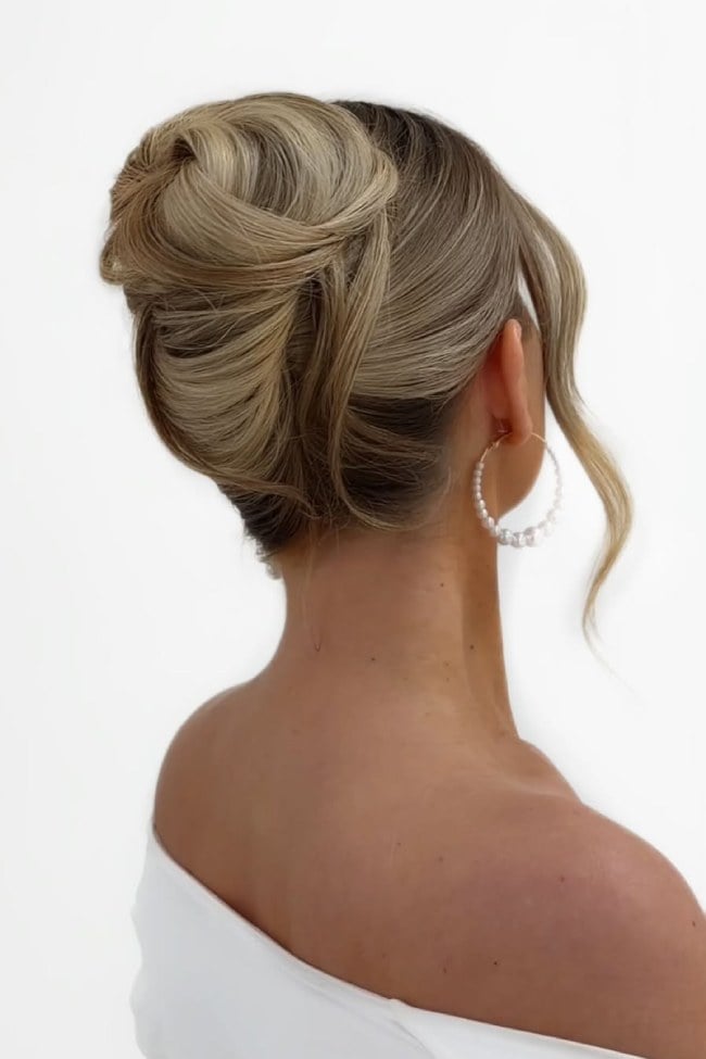 Sleek Blonde Bun With Wispy Bangs — Elegant Updo Inspo