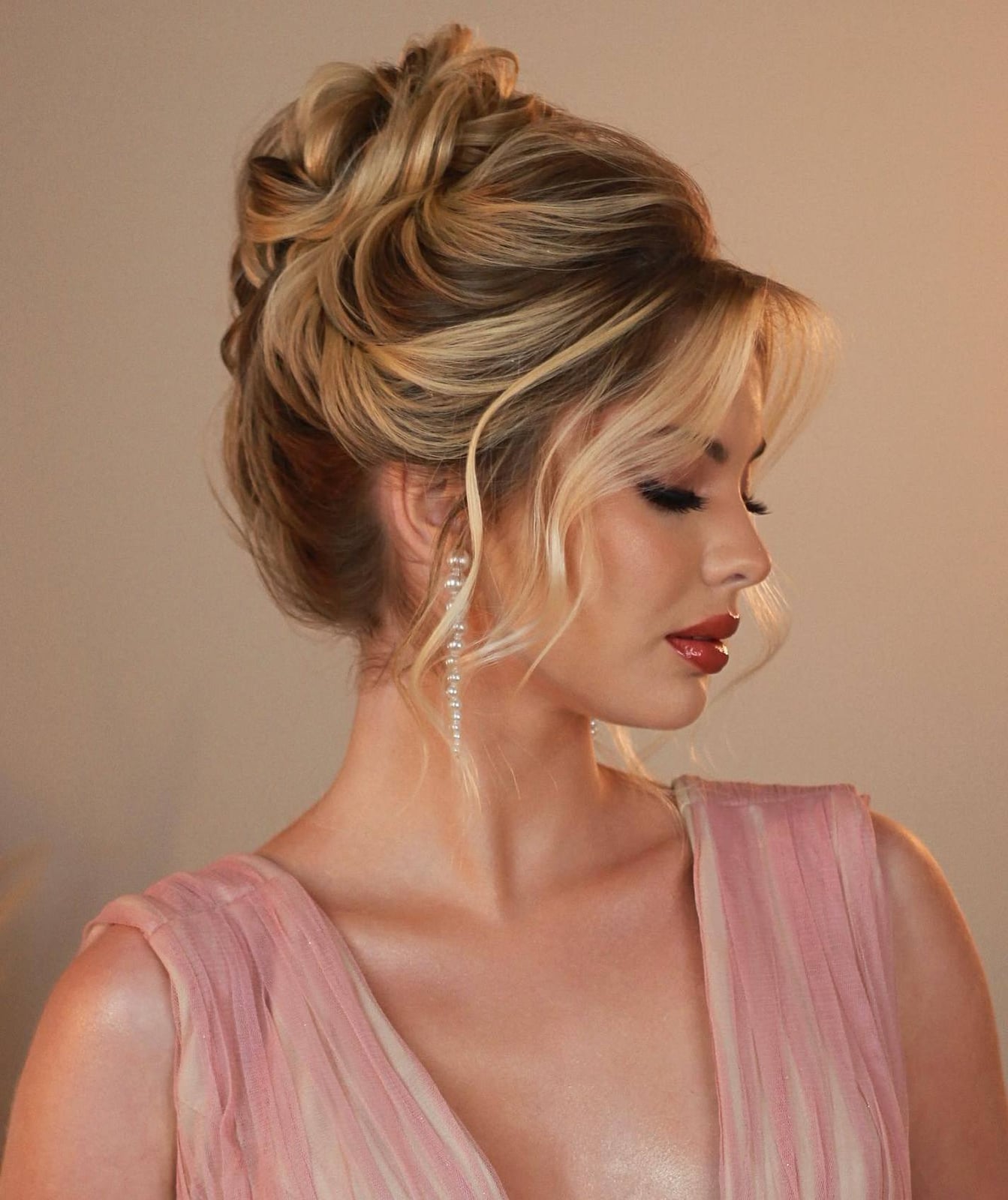 Voluminous Blonde Updo With Soft Tendrils — Elegant Updo Inspo