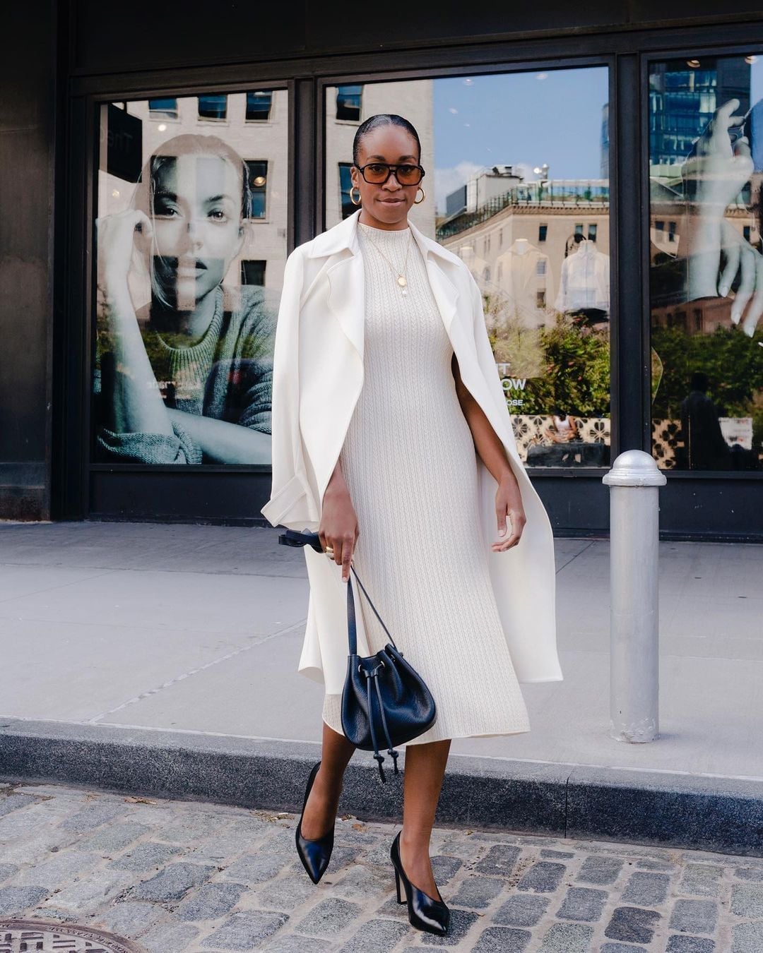 White Coat Draped Over Knit Dress with Black Accents White Coat Draped Over Knit Dress with Black Accents — Elegant White Jacket Outfit
