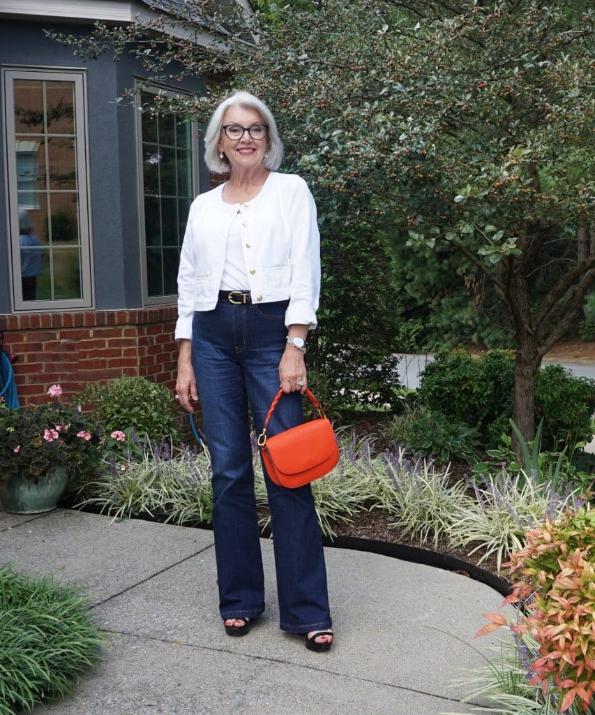 White Cropped Tweed Jacket with Orange Handbag White Cropped Tweed Jacket with Orange Handbag — Elegant White Jacket Outfit