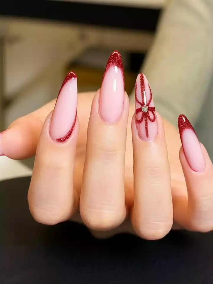 Long Almond Nails with Red Glitter French Tips and Bow Long Almond Nails with Red Glitter French Tips and Bow — Gel Nail Art Ideas