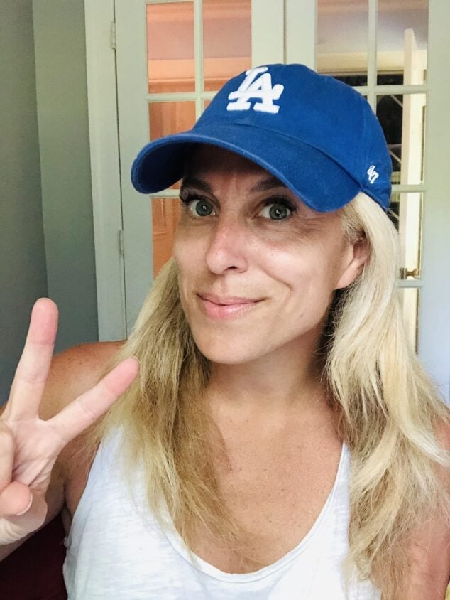 Mid-Back Ash Blonde Waves with Blue Baseball Cap — Hair Ideas with Hat