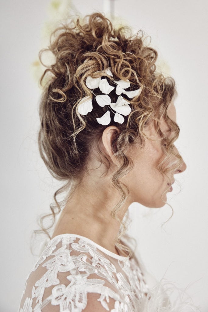 Voluminous Blonde Curly Bun With Accessory Voluminous Blonde Curly Bun With Accessory — Natural Bun Ideas