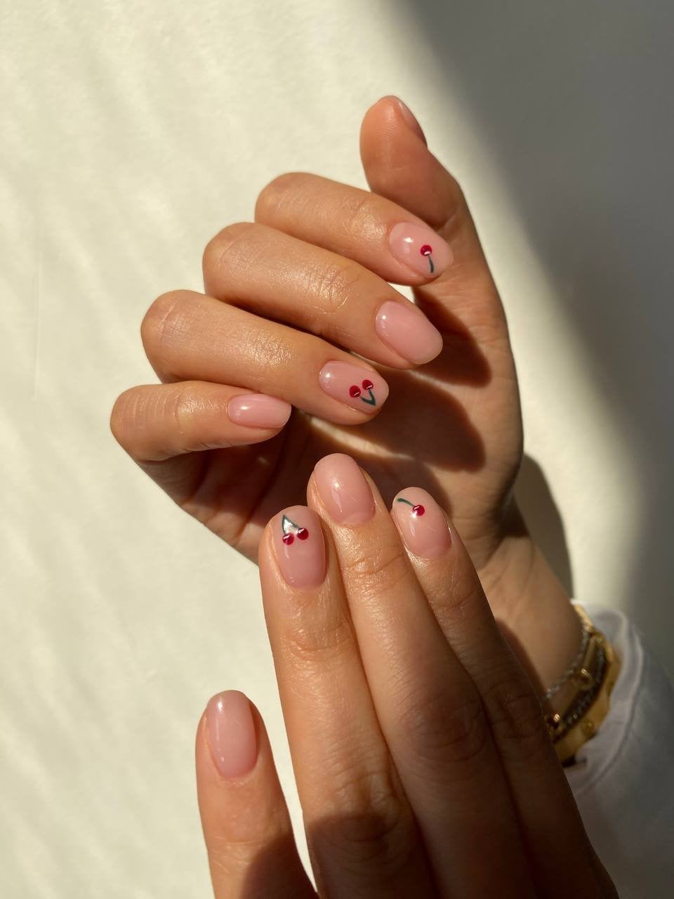 Sheer Pink Small Cherry Accent Short Oval Nails Sheer Pink Small Cherry Accent Short Oval Nails — Russian Manicure Designs