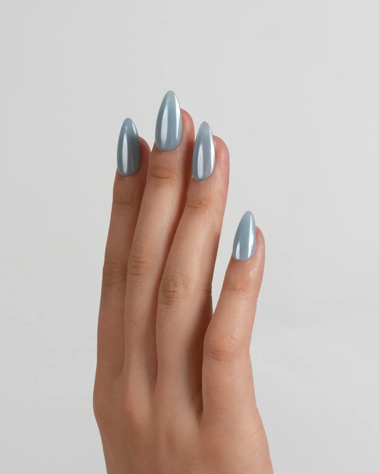 Light Blue Chrome Short Almond Nails, Close-Up Take Light Blue Chrome Short Almond Nails, Close-Up Take — Simple Blue Chrome Nails
