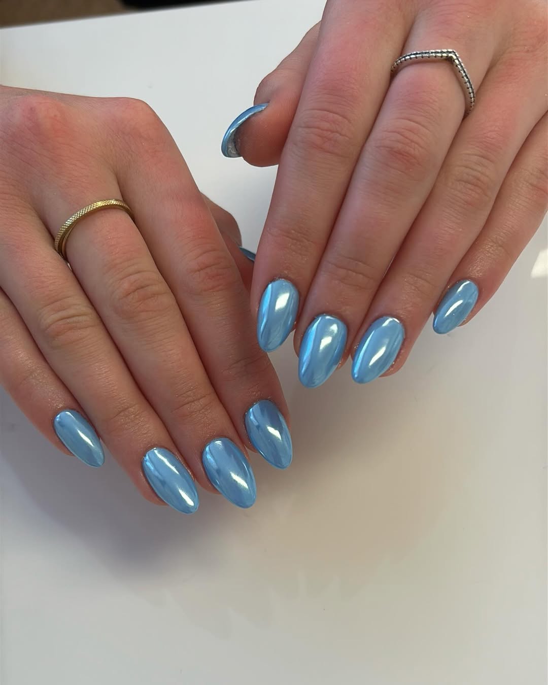 Light Blue Chrome Short Oval Both Hands With Showcasing A High-Shine Light Blue Chrome Short Oval Both Hands With Showcasing A High-Shine — Simple Blue Chrome Nails