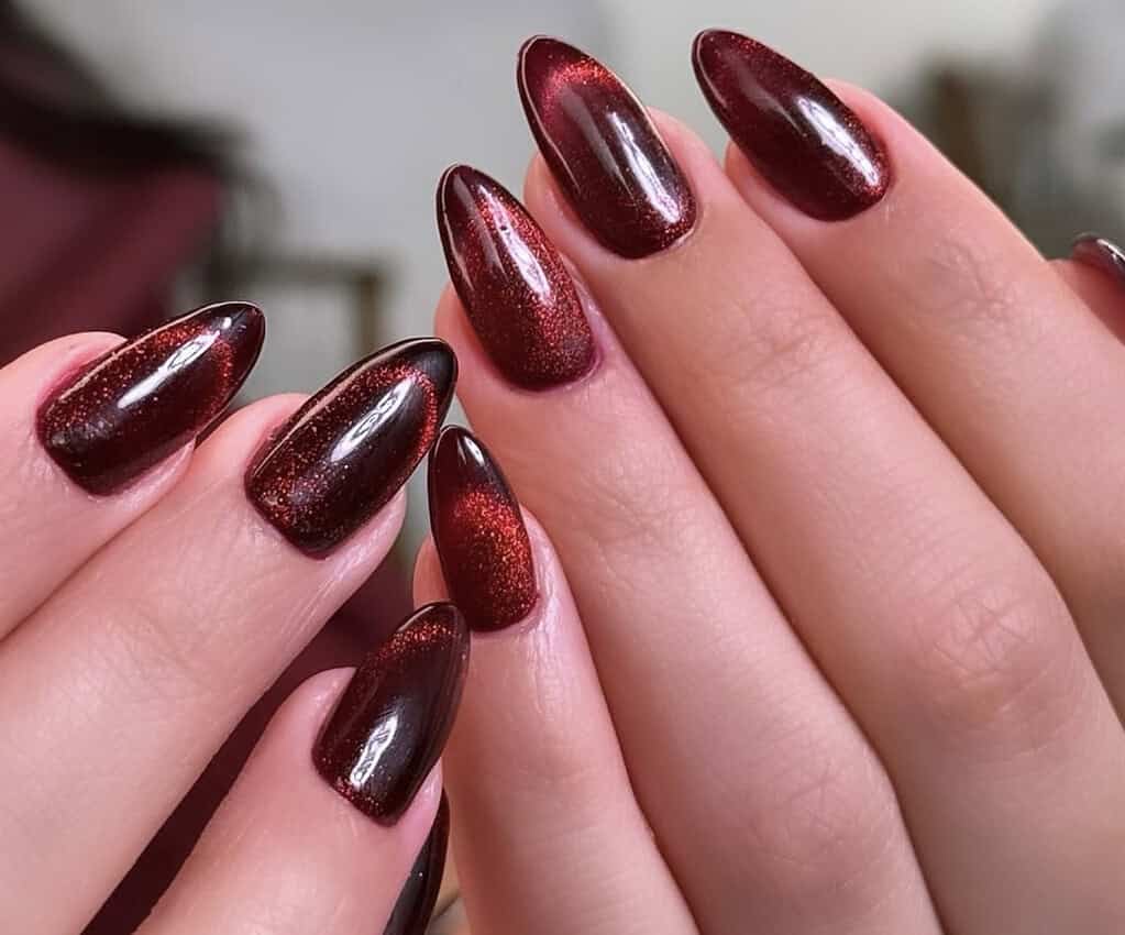 Deep Burgundy Cat Eye Short Oval Nails, Close-Up Take Deep Burgundy Cat Eye Short Oval Nails, Close-Up Take — Simple Burgundy Nails Design
