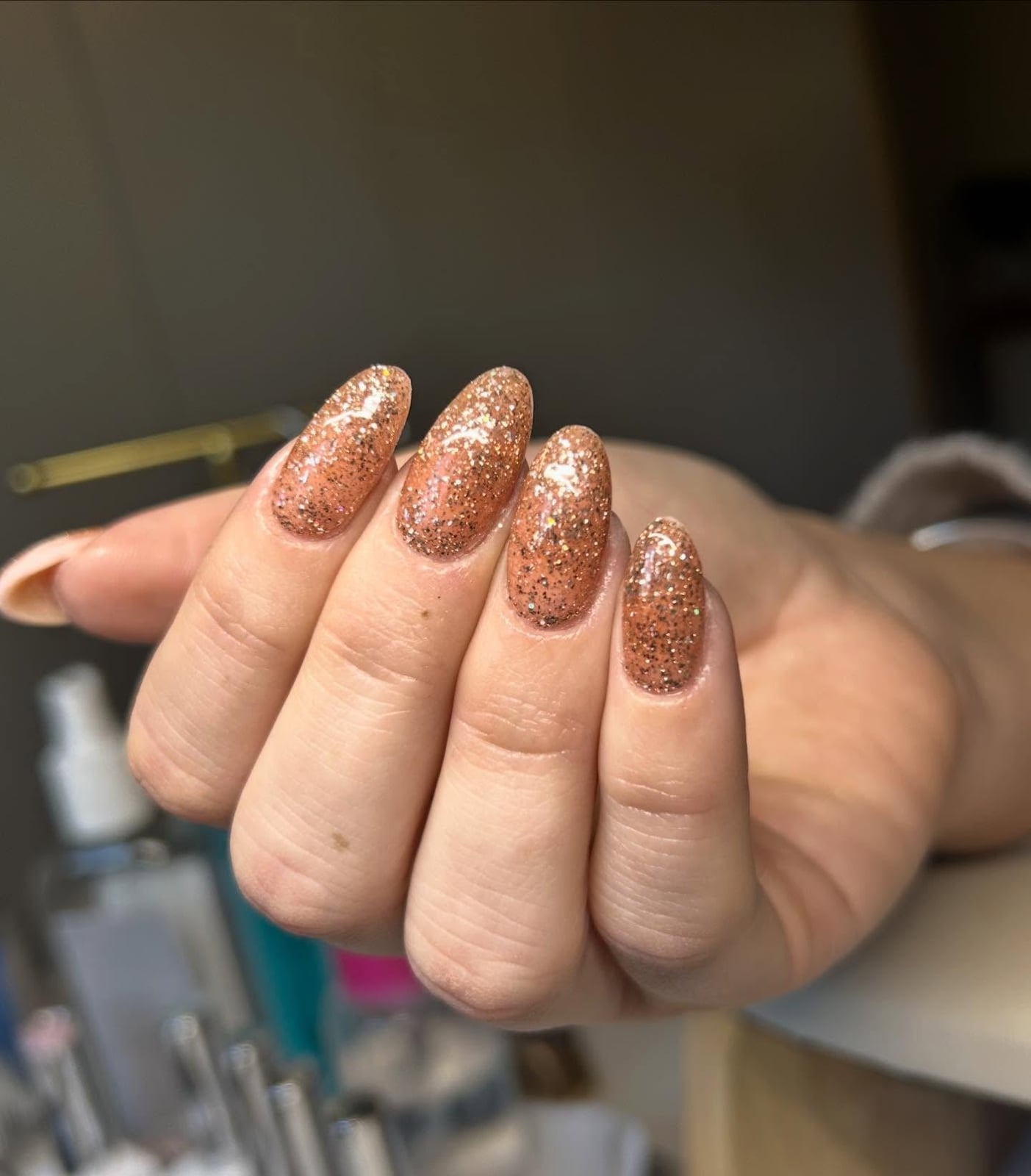 Medium Stiletto Nude With Gold Celestial Motifs, Close-Up Take Medium Stiletto Nude With Gold Celestial Motifs, Close-Up Take — Simple Champagne Nails