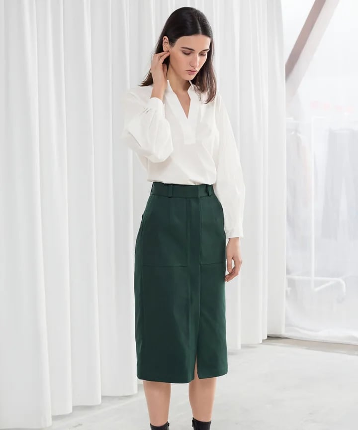 A Dark Green Pencil Skirt Grounds a Voluminous White Blouse A Dark Green Pencil Skirt Grounds a Voluminous White Blouse — Simple Corporate Outfits for Women