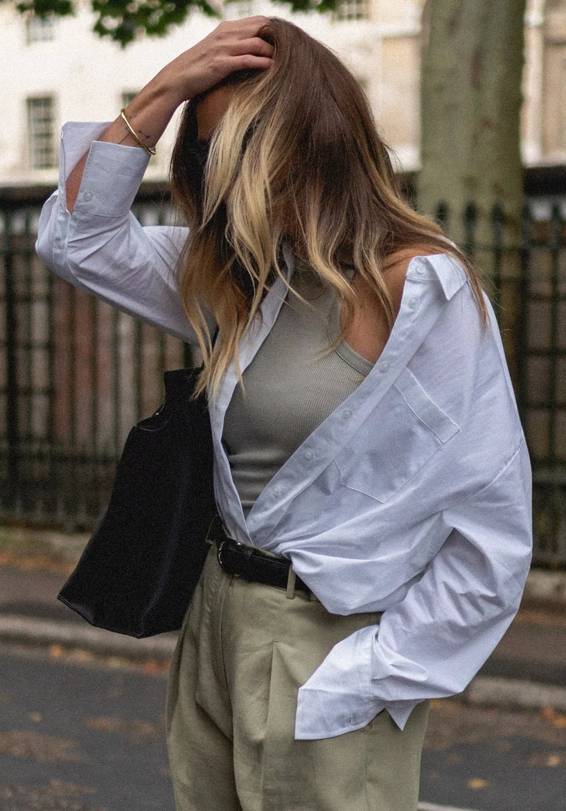 White Oversized Shirt Over Gray Tank with Beige Trousers White Oversized Shirt Over Gray Tank with Beige Trousers — Simple Court Outfits