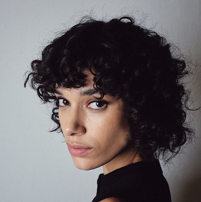 Black Chin Length Bob With Simple Curly Bangs