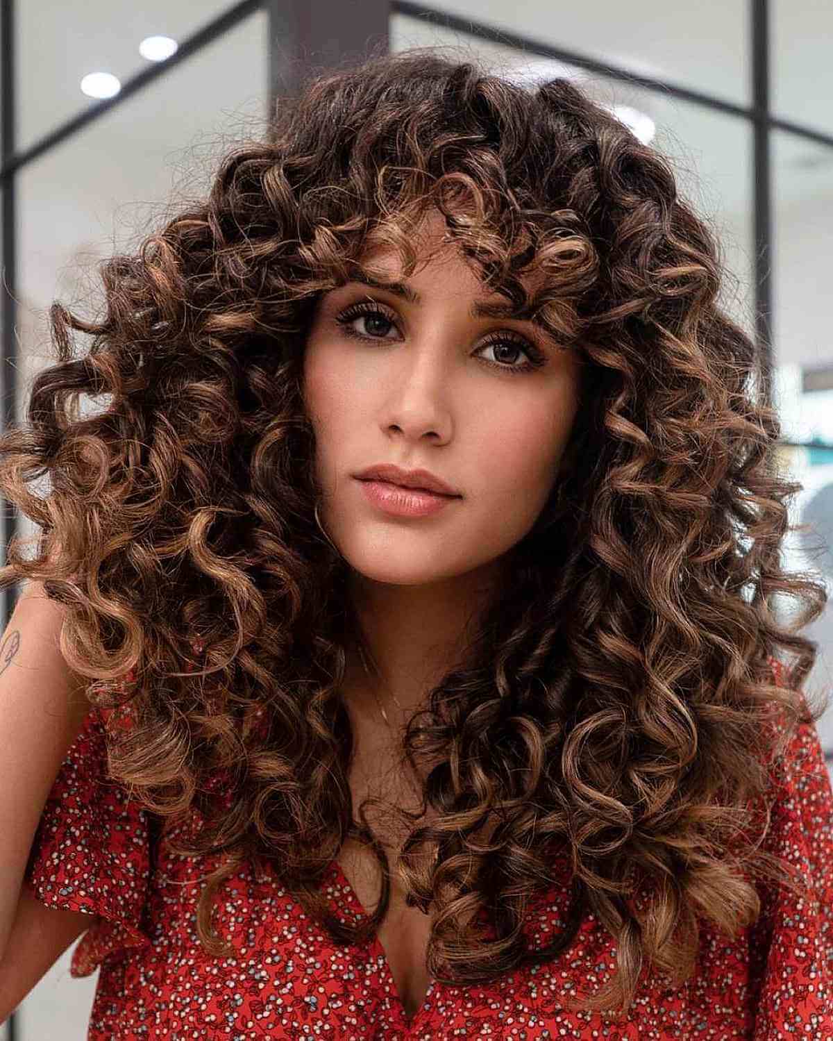 Mid-Back Layers With Balayage And Full Curly Bangs — Simple Curly Bangs