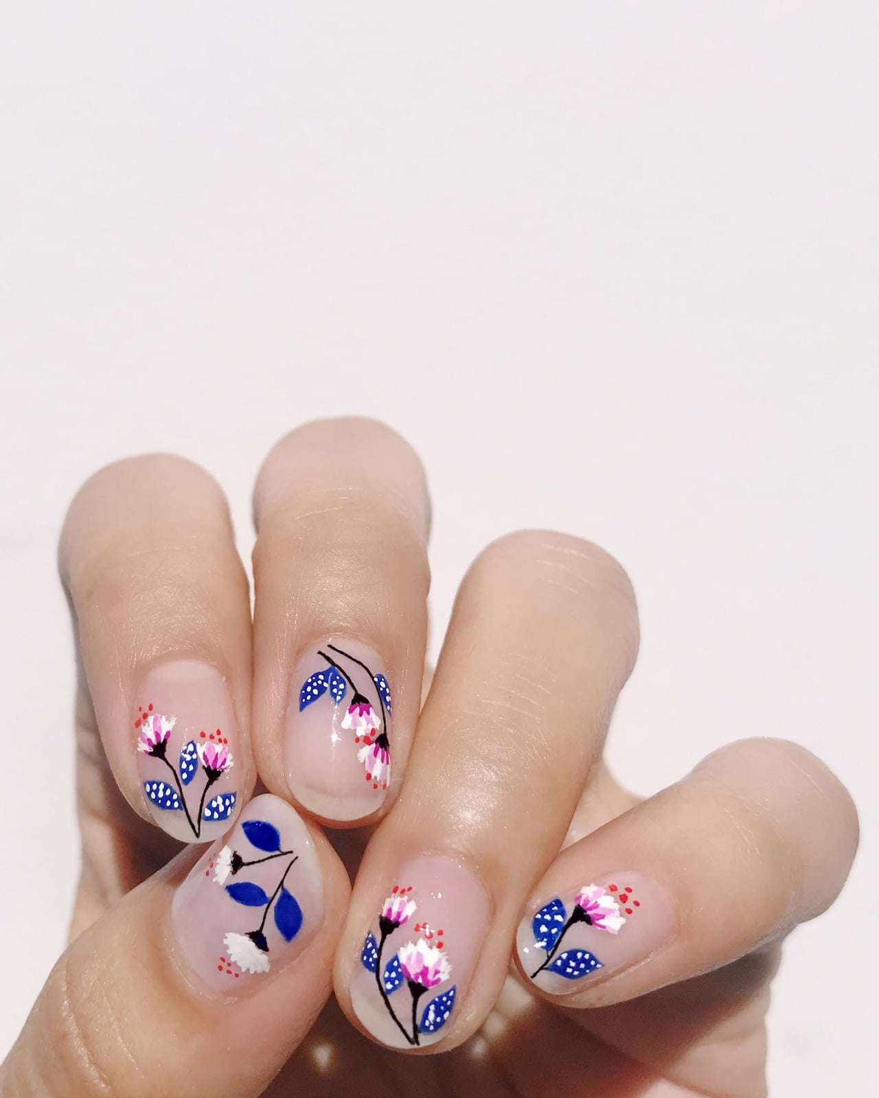Short Square Sheer Base with Pink Floral Motifs Short Square Sheer Base with Pink Floral Motifs — Simple Floral Nails