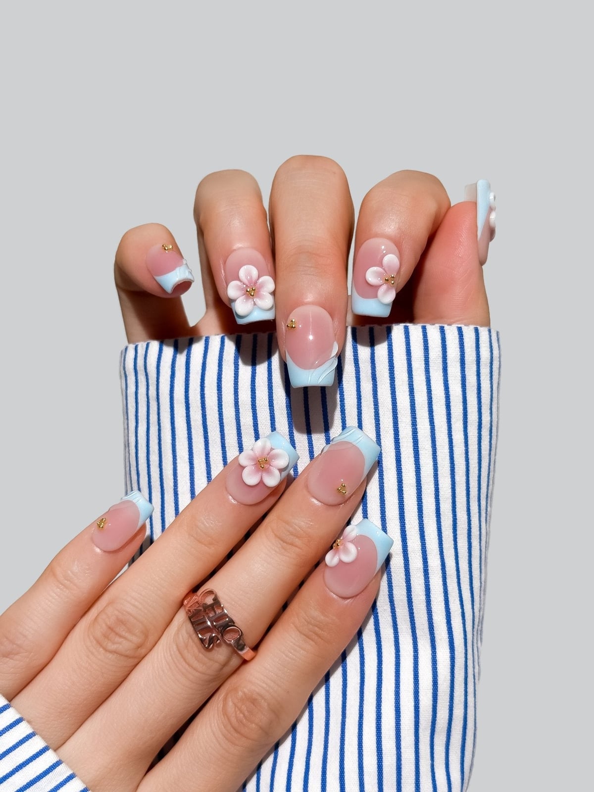 Short Square Nude With Blue French And 3D Flowers Short Square Nude With Blue French And 3D Flowers — Simple Flower Nails
