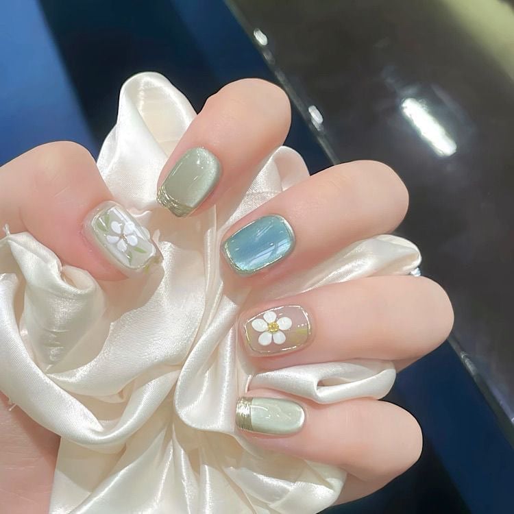 Short Almond Mint Cat-Eye With Floral Accents Short Almond Mint Cat-Eye With Floral Accents — Simple Korean Nails