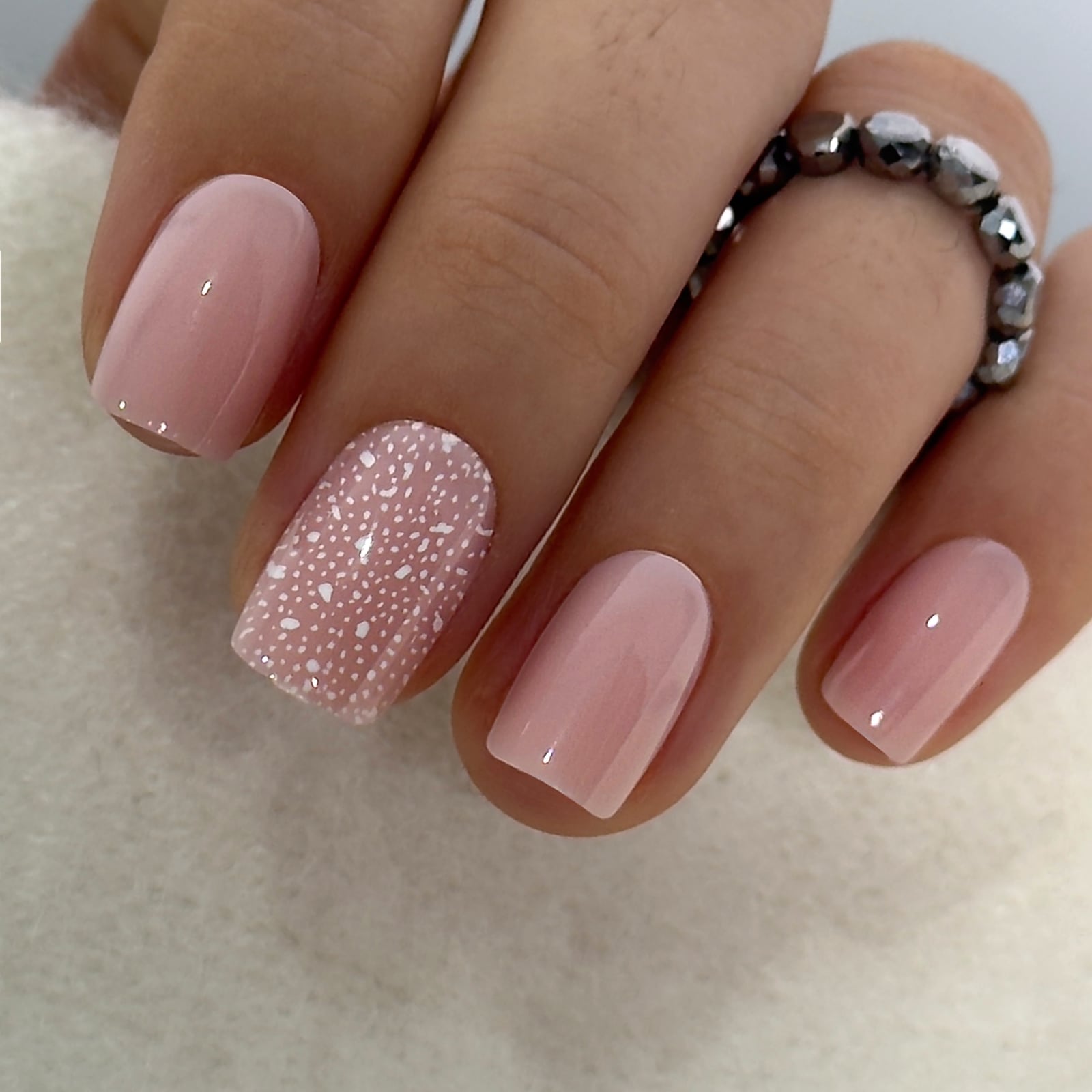 Milky Pink With White Speckle Accent Milky Pink With White Speckle Accent — Simple Squoval Nails
