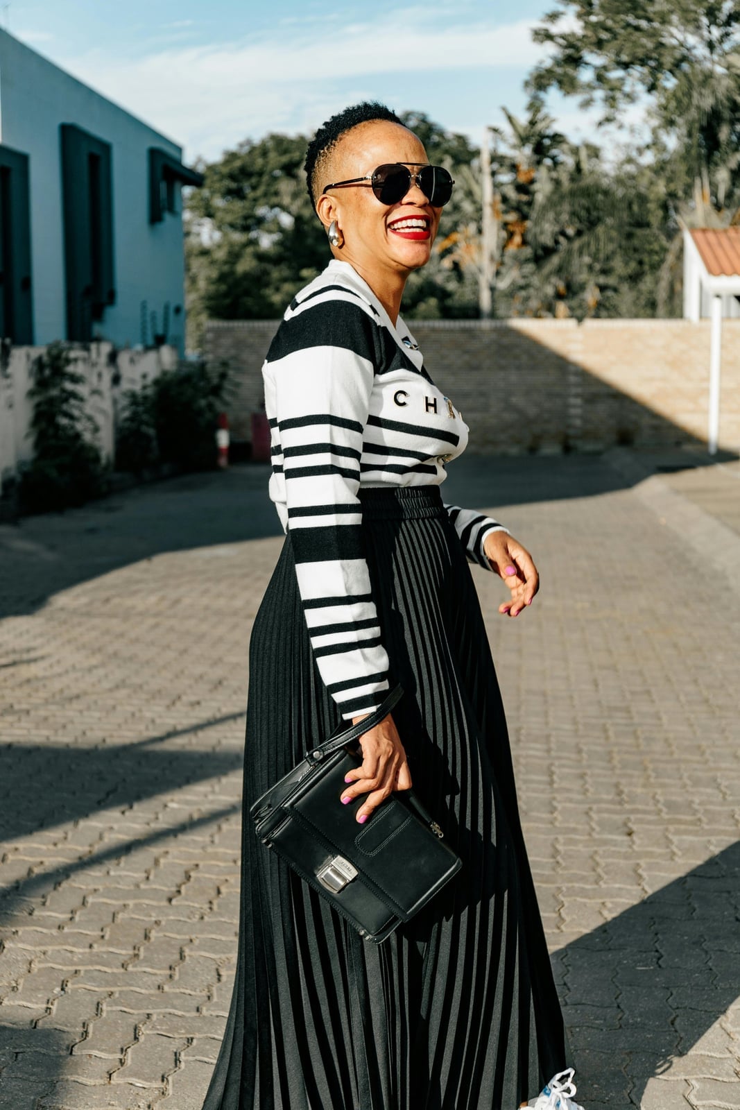 Striped Long-Sleeve Top with a Black Pleated Midi Skirt — Trendy 50s Style