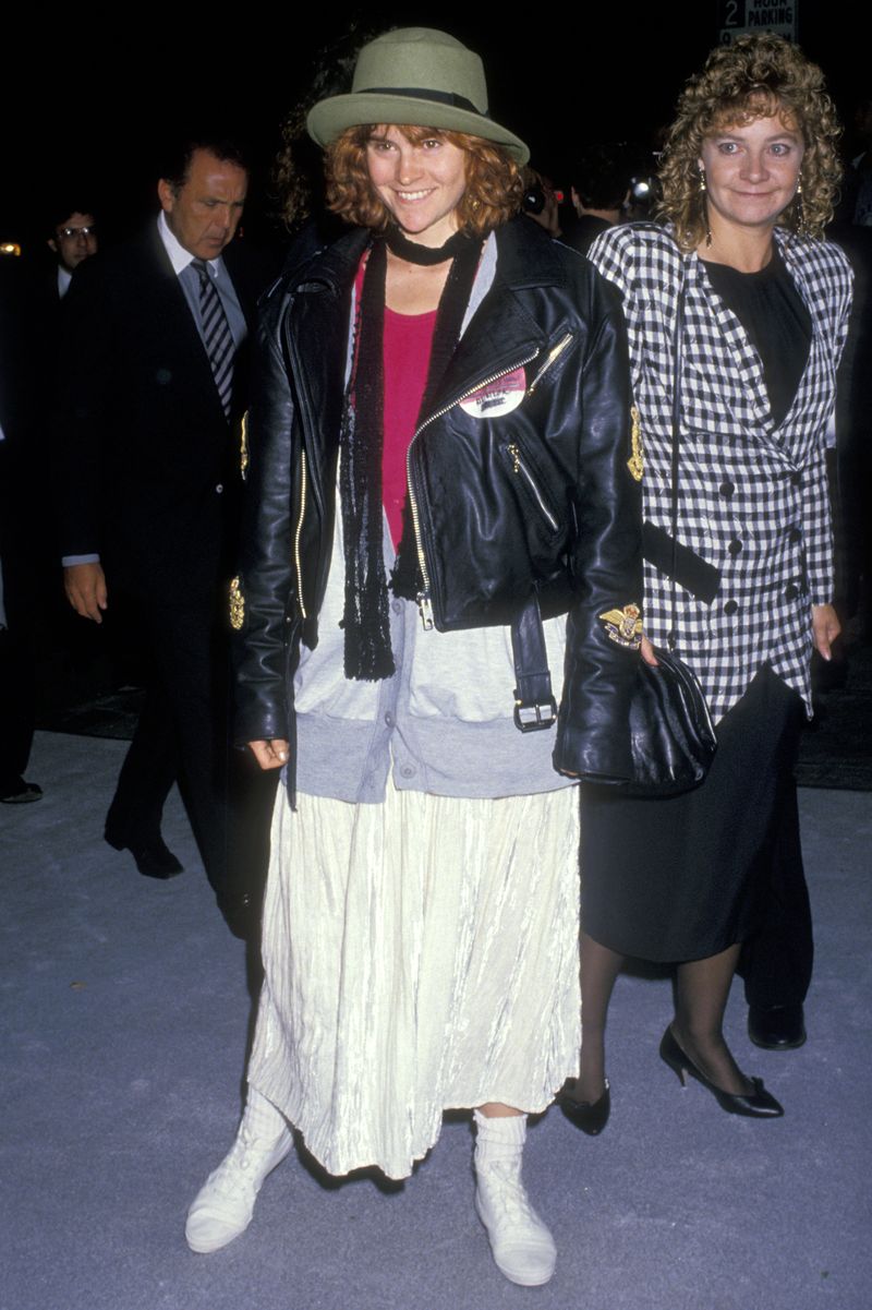 Black Leather Jacket Over a Gray Cardigan and White Dress Black Leather Jacket Over a Gray Cardigan and White Dress — Trendy 80s Party Outfit
