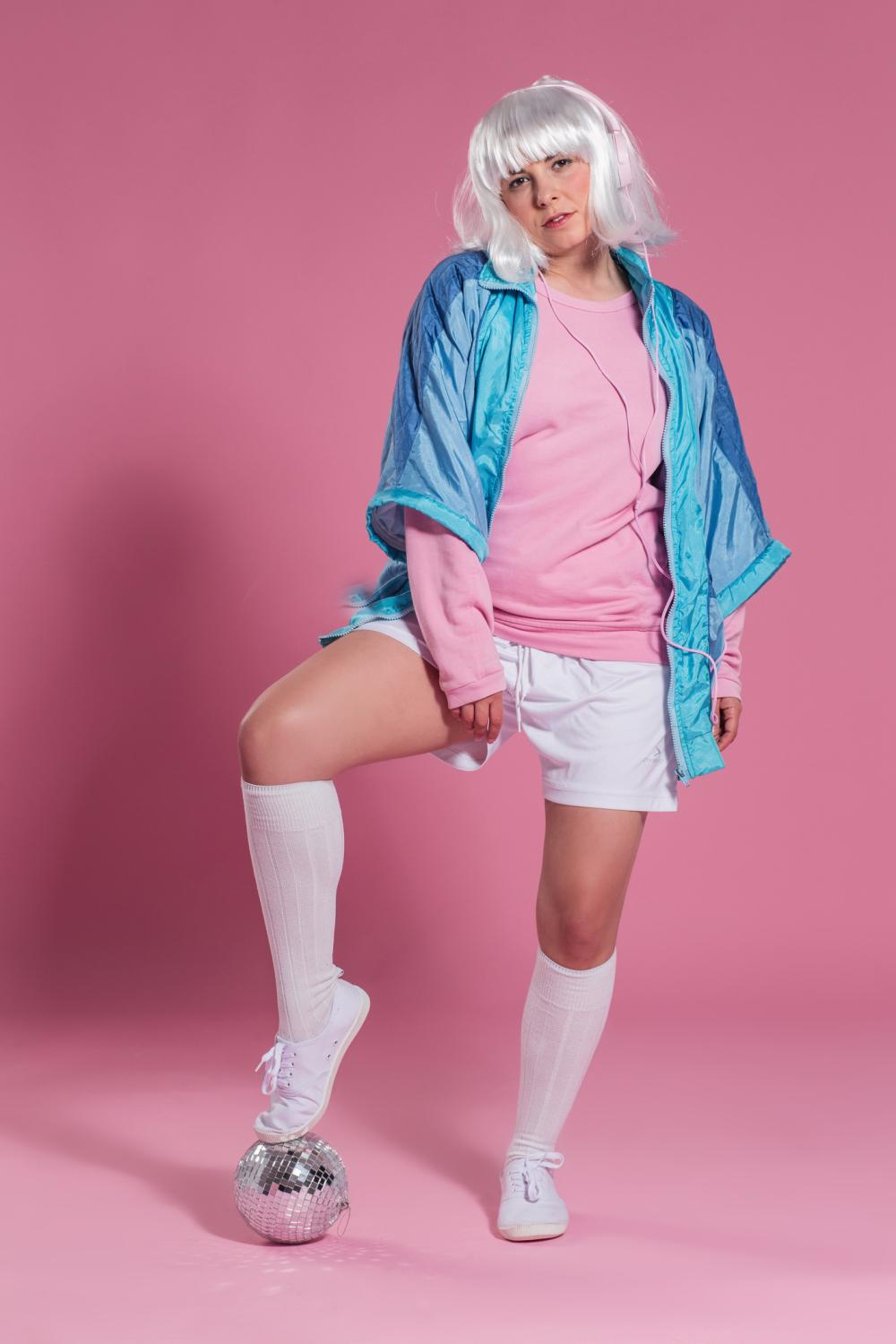 Pink Sweatshirt with Blue Windbreaker and White Shorts Pink Sweatshirt with Blue Windbreaker and White Shorts — Trendy 80s Party Outfit