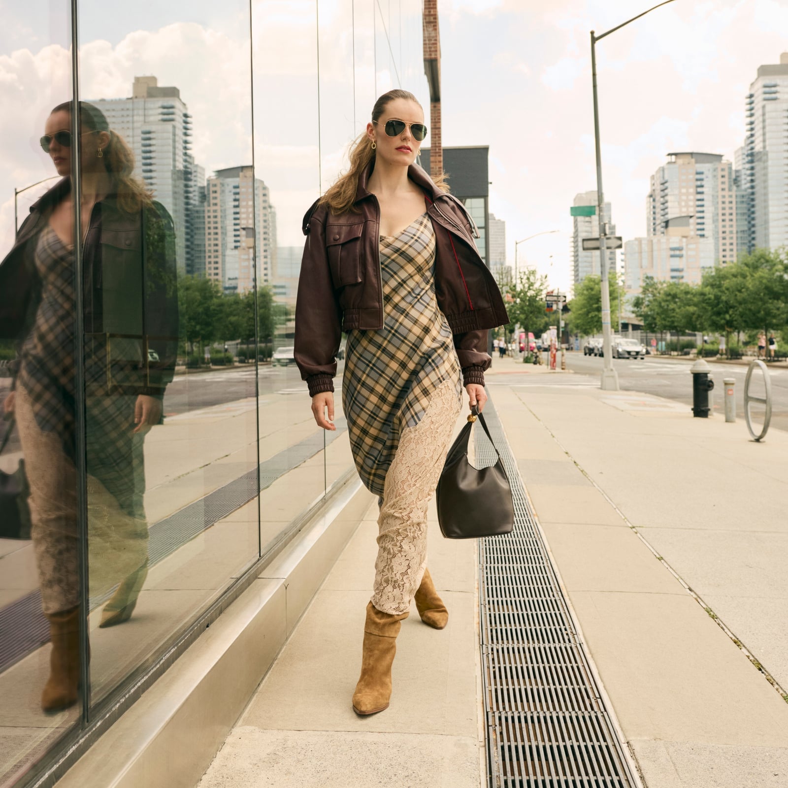 Brown Leather Bomber Jacket Over a Plaid Slip Dress — Trendy 90s Style