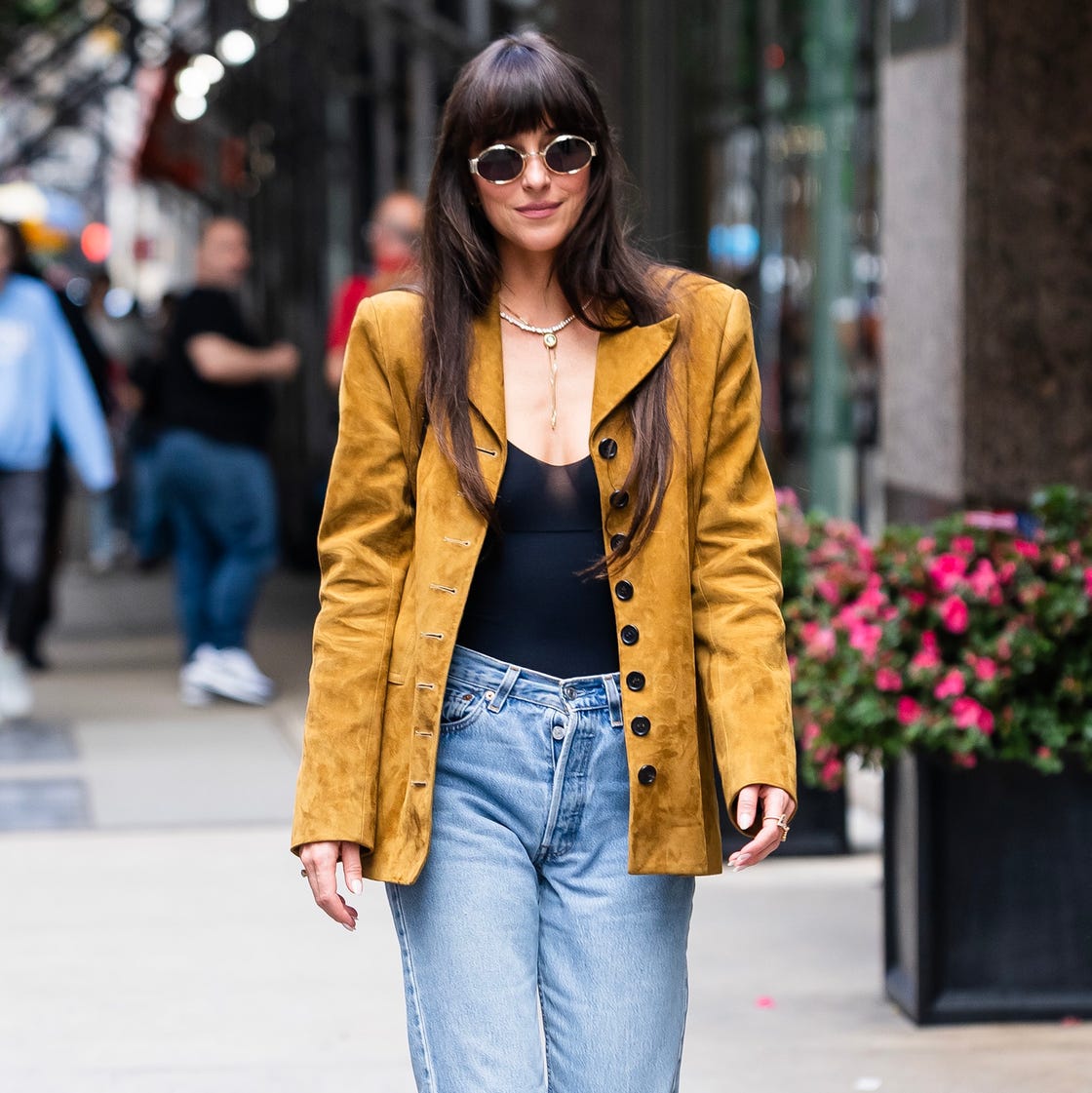 Mustard Yellow Suede Blazer Over a Black Bodysuit and Jeans — Trendy 90s Style