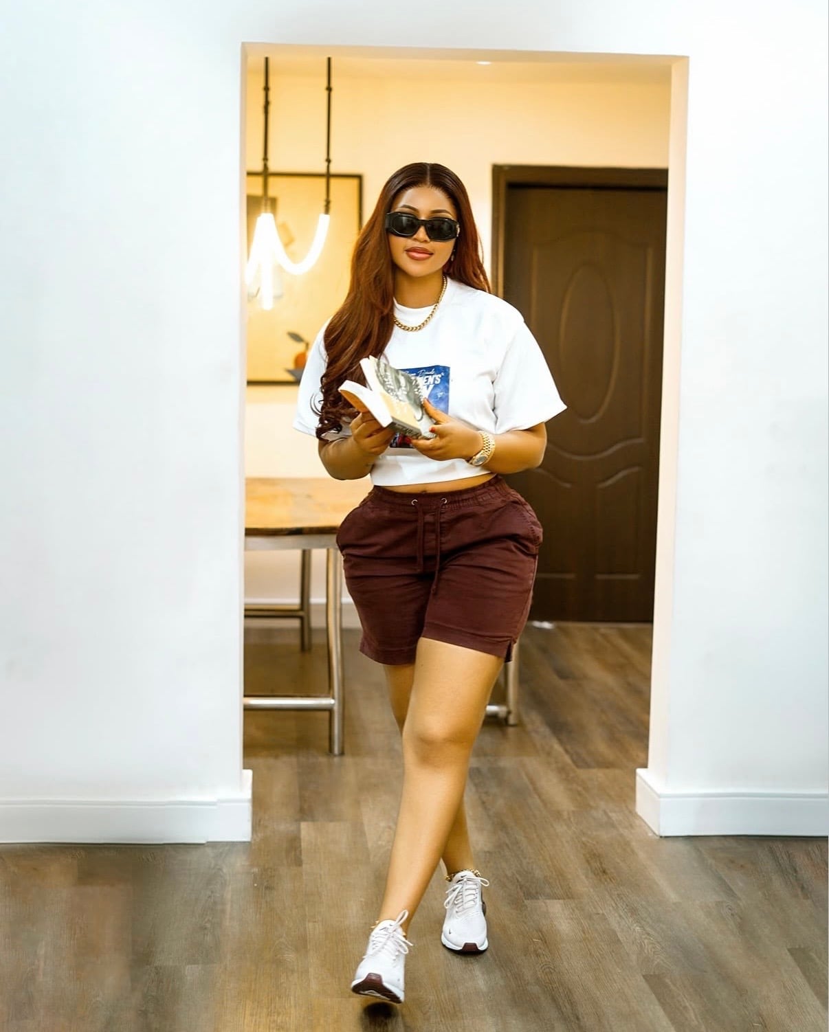 Graphic T-Shirt with Drawstring Shorts and Sneakers, Close-Up Take — Trendy Athleisure Outfits