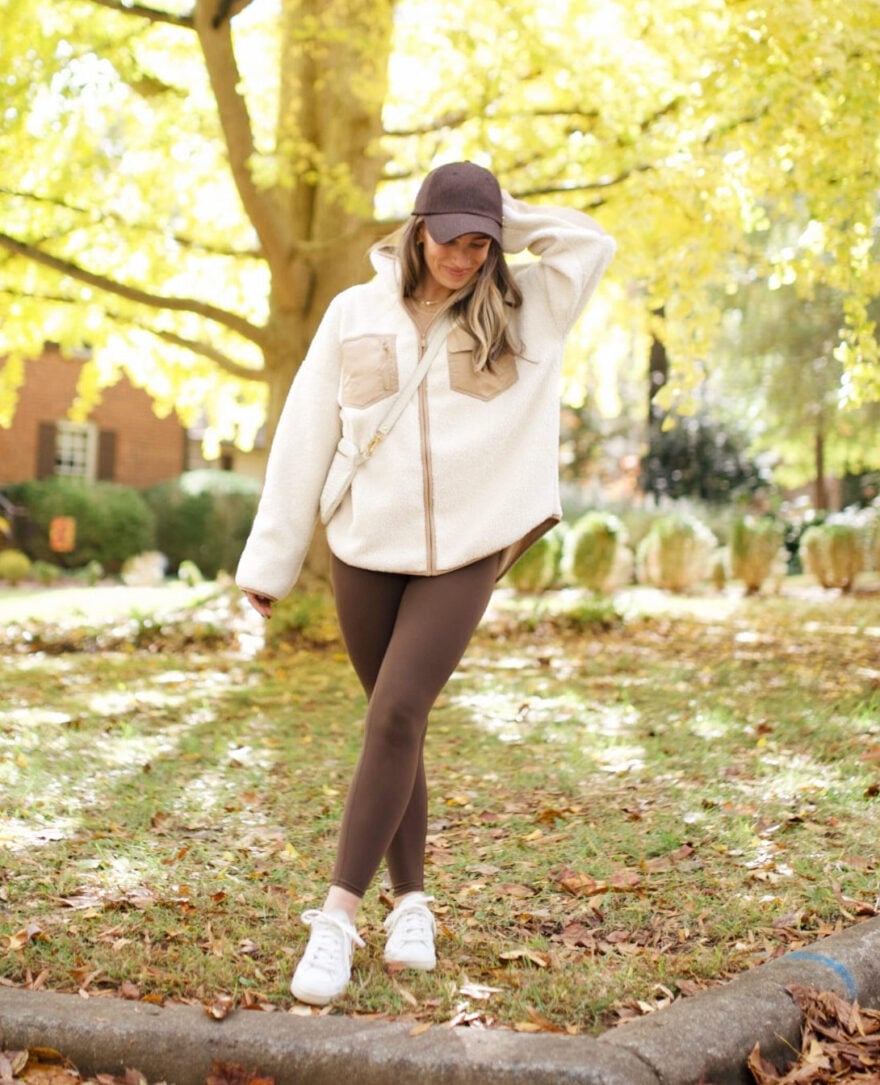 Sherpa Jacket Over Mock Neck and Leggings With Brown Baseball Cap — Trendy Athleisure Outfits