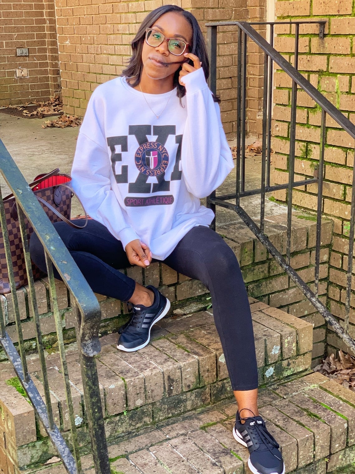 Graphic Sweatshirt with Black Leggings and Sneakers — Trendy Athleisure Outfits