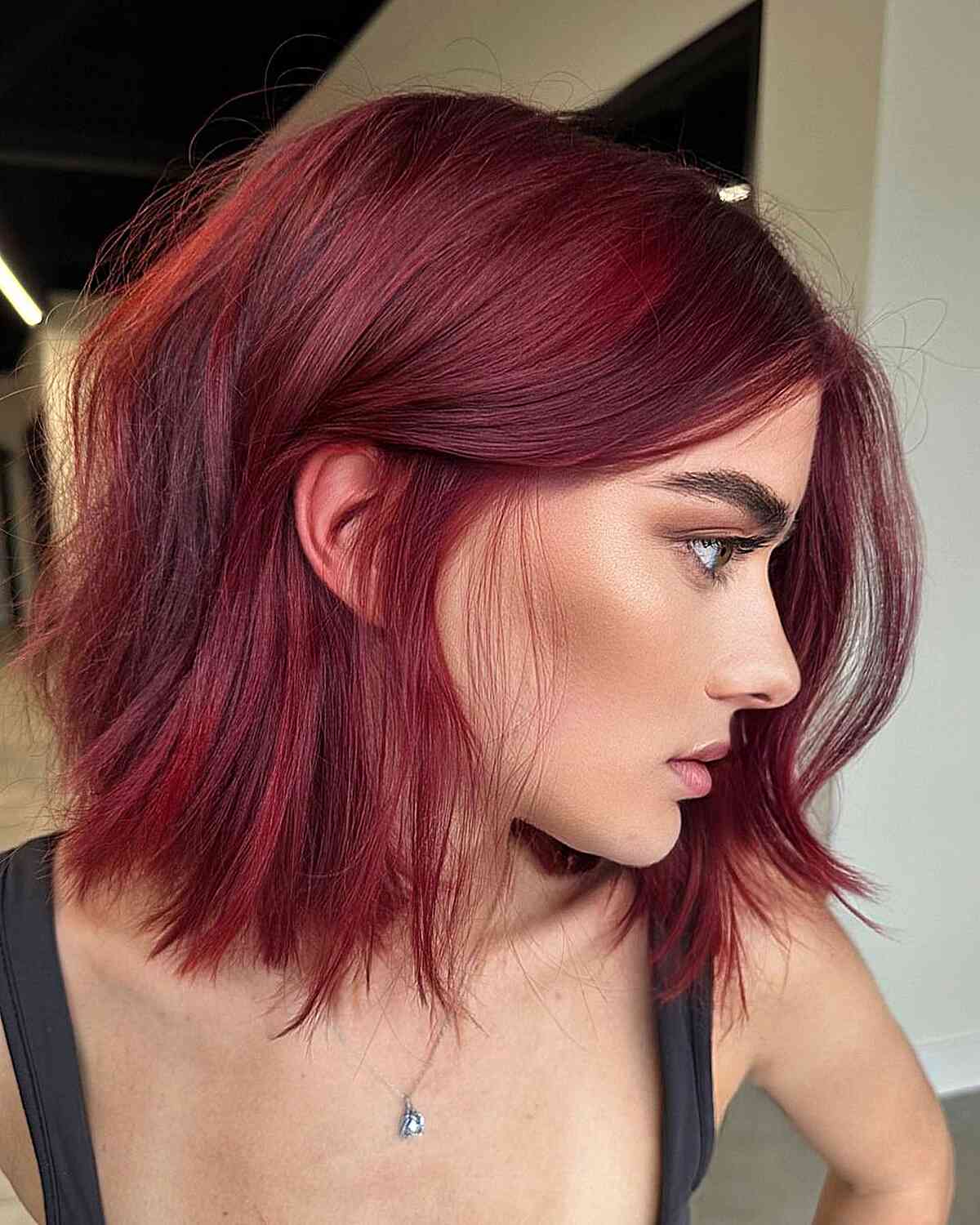 Sharp Angled Bob In Deep Cherry Red Sharp Angled Bob In Deep Cherry Red — Trendy Auburn Hair Color