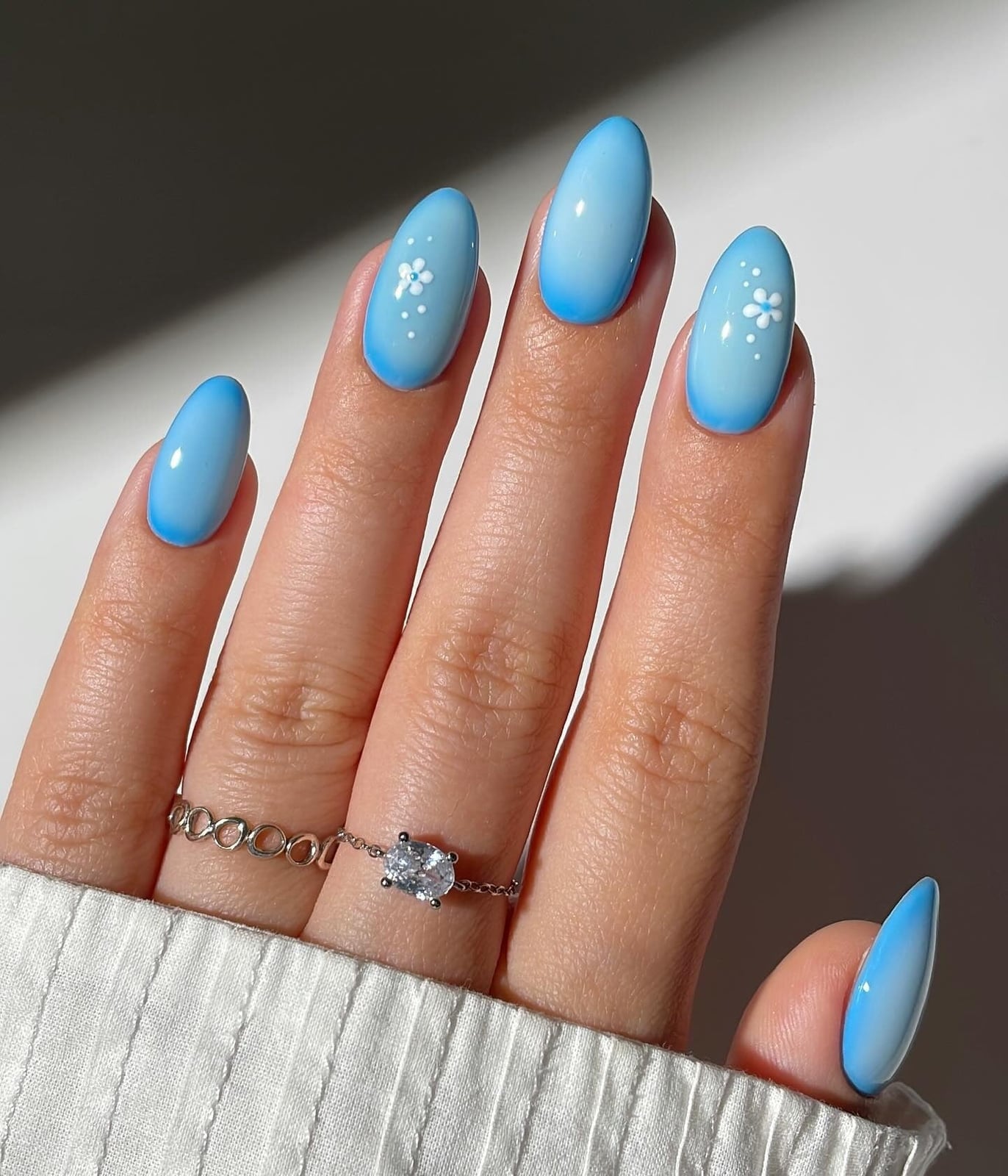 Medium Almond Blue Ombre With Floral Dots — Trendy Baby Blue Nails