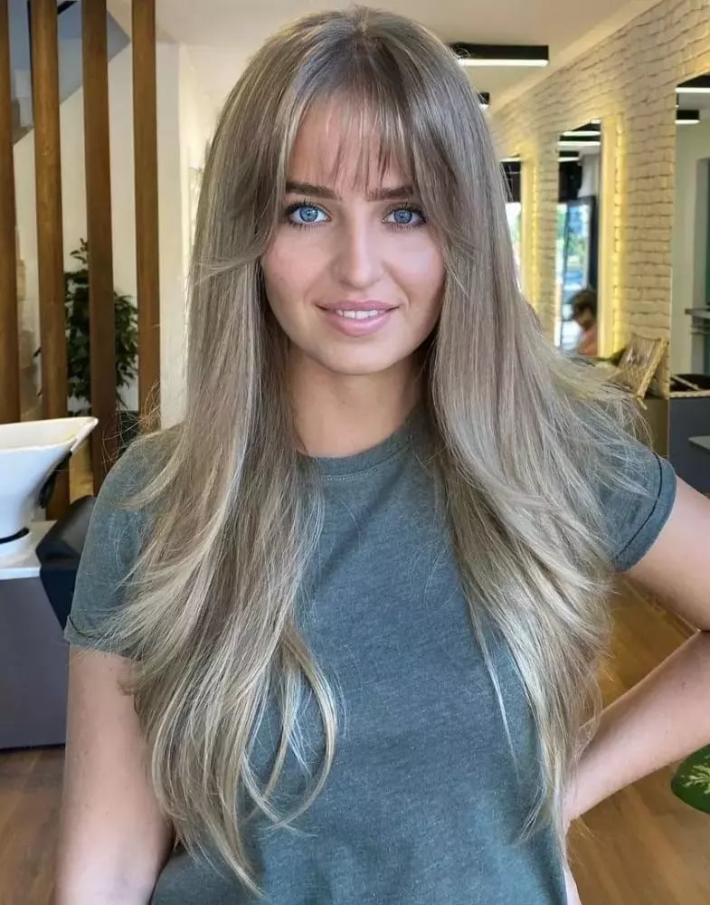 Mid-Back Layers With Ash Blonde Curtain Bangs Mid-Back Layers With Ash Blonde Curtain Bangs — Trendy Bangs Style