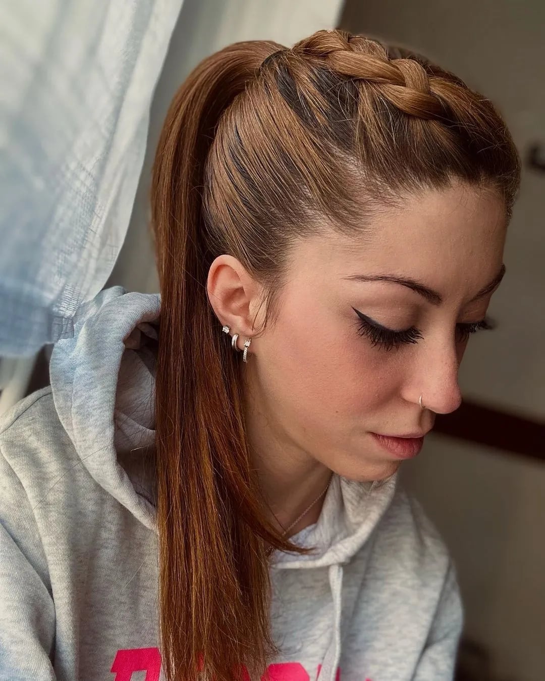 Mid-Back High Ponytail With Braided Accent — Trendy Basketball Hairstyles