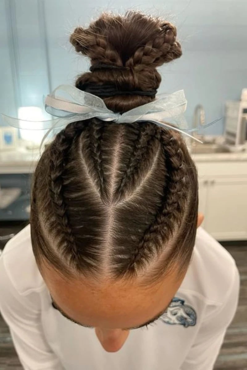 Dark Brown Braided Bun With Intricate Cornrows — Trendy Basketball Hairstyles